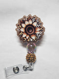 Badge reel gold sunflower