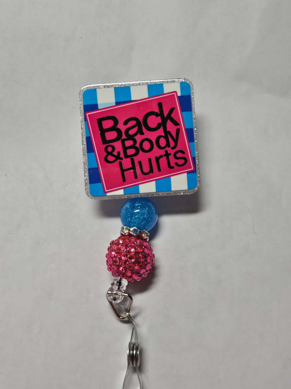 Badge reel back and body hurts